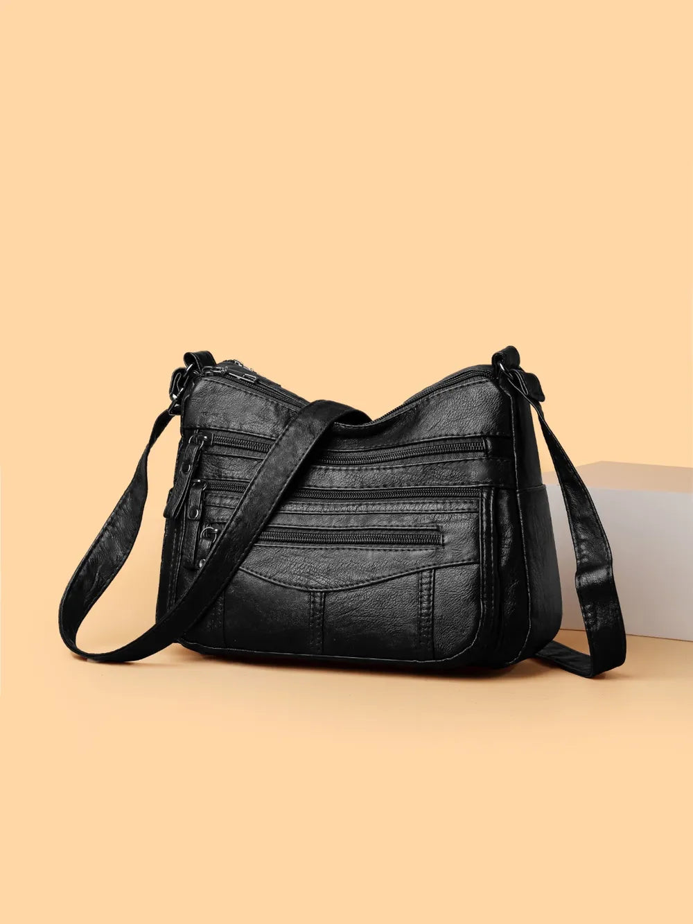 Bolso bandolera con varios compartimentos de 26 × 18 × 9 cm