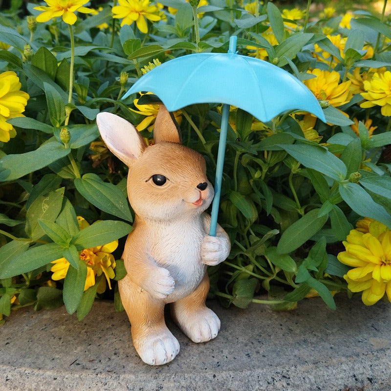 Figura de conejo con paraguas para jardín