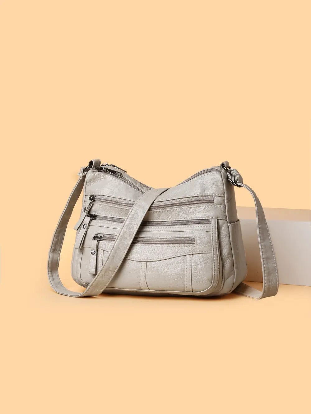 Bolso bandolera con varios compartimentos de 26 × 18 × 9 cm