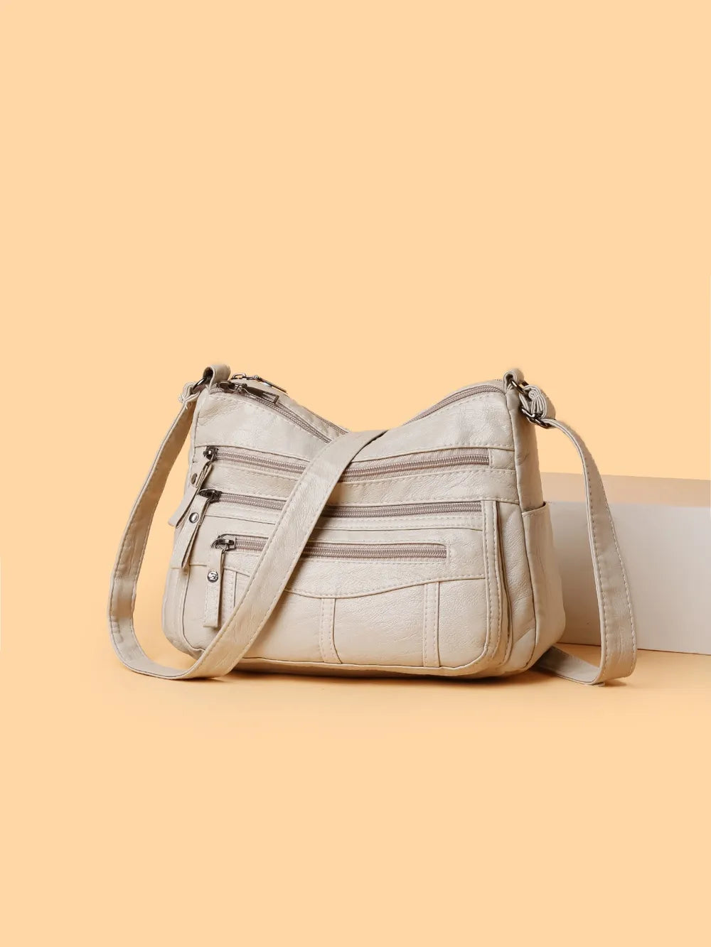 Bolso bandolera con varios compartimentos de 26 × 18 × 9 cm