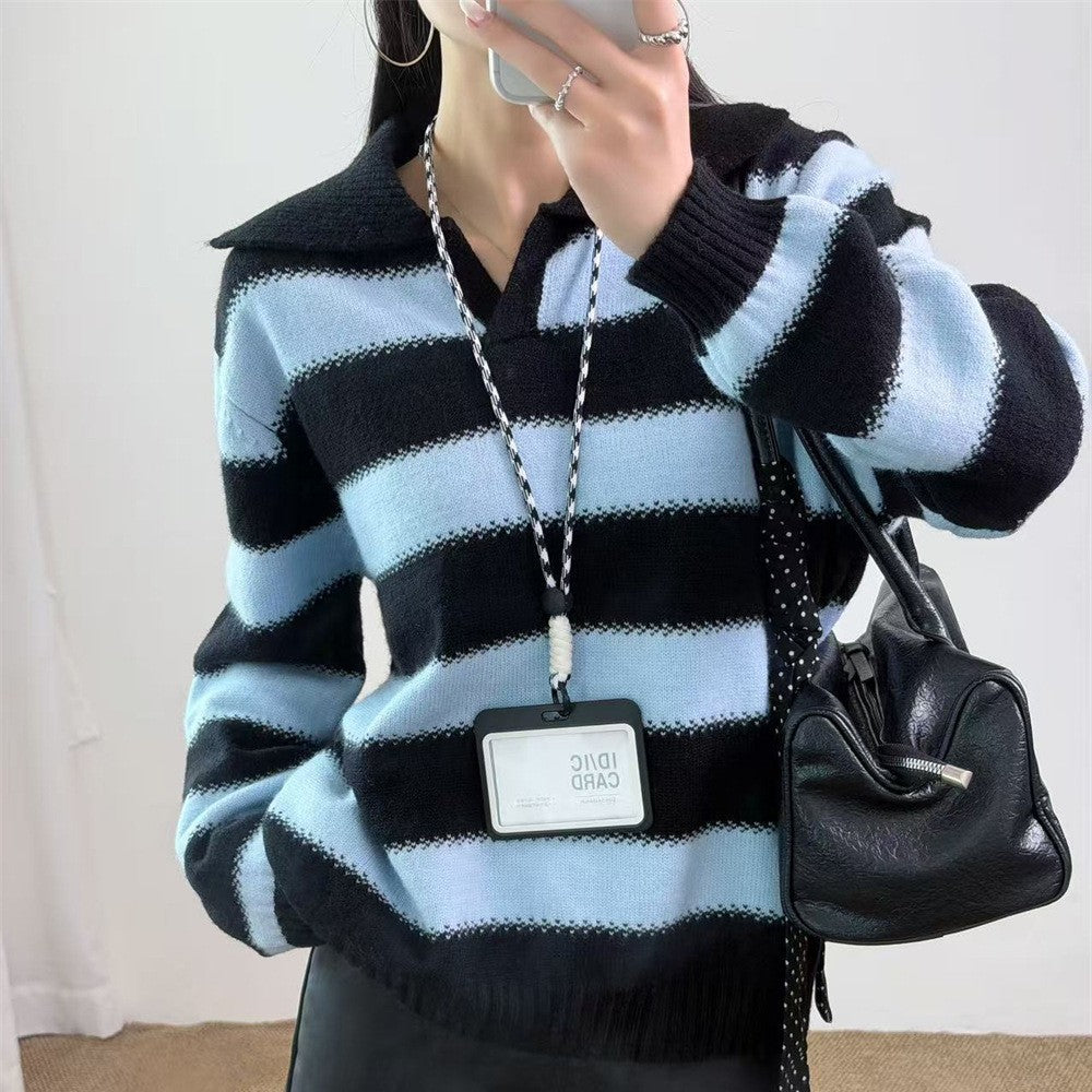 Suéter holgado de rayas con cuello polo