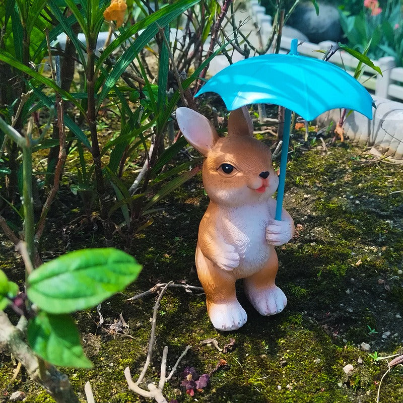 Figura de conejo con paraguas para jardín
